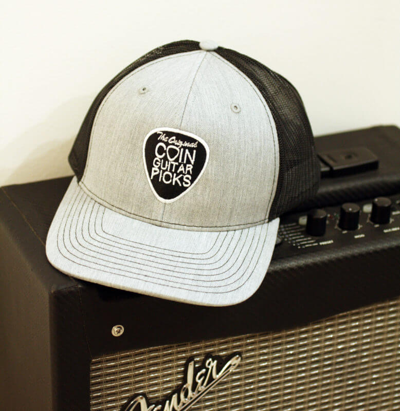 The Original Coin Guitar Picks Hat on amp